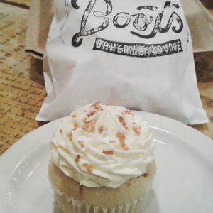 Coconut cupcake perfection!   at Boots Bakery & Lounge in Spokane