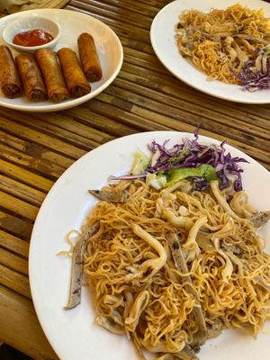 Spring rolls with chilli sauce dip, and fried noodle with mushroom and vegan ham at Nhà hàng chay Veggie Saigon - Vietnam Vegan Heritage in Hoi An
