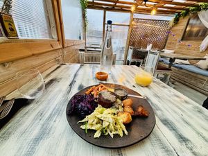 Outside covered veranda, interior restaurant seating also available.   at Reishi Plant Kitchen in Worcester