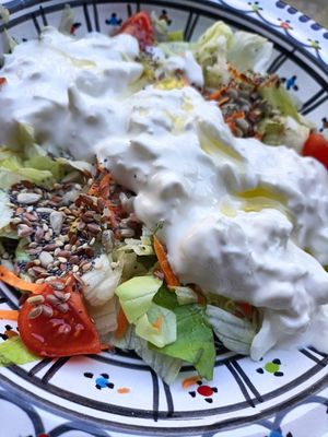 A tantalizing organic salad topped with a delicious stracciatella - the juicy part of a mozzarella from buffalo's milk, and vegan pesto (garlic free). €15 at Ecologica Bistrot in Palermo