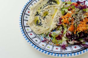 Home made Humus and salad, served with bread. No garlic! €10 at Ecologica Bistrot in Palermo