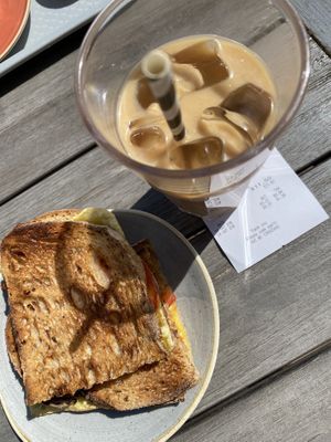 Vegan cheese and tomatoes toasties and soya caramel iced latte   at The Courtyard Cafe in Bristol