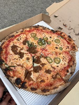 2 halves of diff vegan pies assembled into one   at Ollie's Pizza in High Falls