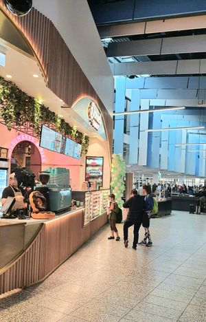 store front at Terminal 4 (security control in background) at MEL - Daniel's Donuts - T4 & T1 in Melbourne