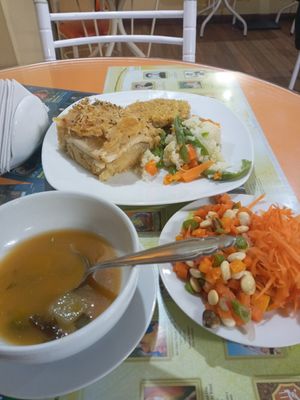 Seaweed soup, bean salad, fried seitan and a potato-tofu-potato pie at Loving Hut - Titikaka in Puno