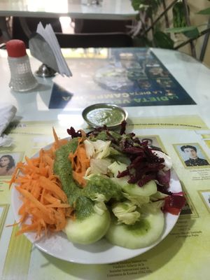 Salad - corriander sauce! 😭 (hate it)  at Loving Hut - Titikaka in Puno