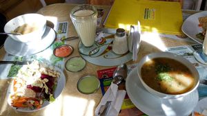 Soups, salad and dressings, warm soy milk at Loving Hut - Titikaka in Puno