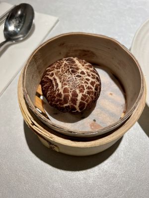 There are 2 vegan buns: mushroom and black sesame. This is surprisingly not the mushroom one (sesame paste filled).  at Fruitful Food 果然匯 in Taipei