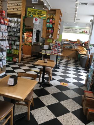 There are some seats inside the store to eat at The Health Nuts - East Side Uptown in New York City