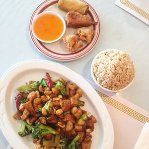 Dinner combo with vegan kung pao chickn, brown rice, and the fried wonton, crispy wing and spring roll combo. This place is so good! at Garden Wok in Tarzana