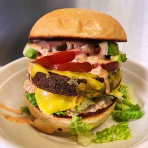 Pacha Burger. In-House Made Patty with organic tofu, lentils, oats, walnuts. Secret Sauce and Avocado gives it a creamy and tasty touch. at Pacha Roots in Miami