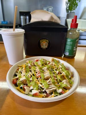Mexican Chop Chop. Non-Gmo soy-based chopped Chkn on a bed of Turmeric Quinoa or Rice, Savory Balck Beans, Lettuce, Tomato and Cheddar. Topped with Cashew Cream and Verde Salsa. at Pacha Roots in Miami