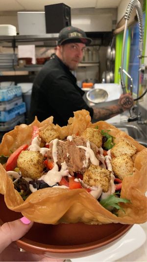 Specials menu taco bowl with tofu and the guy who made it  at Saucony Creek Brewing in Kutztown