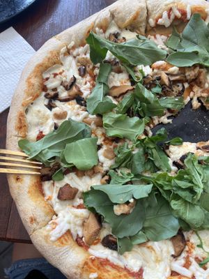 Baby blue pizza with super tasty shiitake  at Vegan Spot by Revolution in Playa Del Carmen