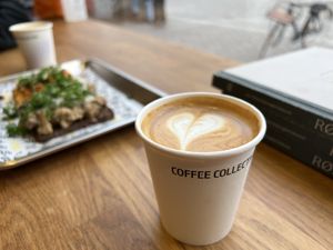 Flat white, taken-away to drink next door at Røst  at Coffee Collective Torvehallerne in Copenhagen