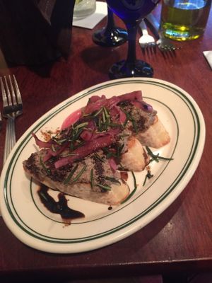 Mushroom pate toast with pickled onions and rosemary  at New World Bistro Bar in Albany