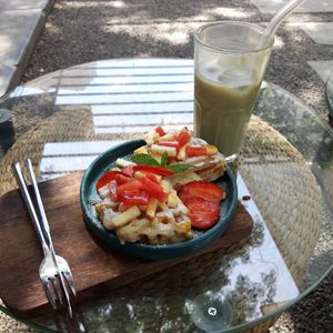 Matcha w soy milk and waffles at Bloom Coffee in Lalitpur