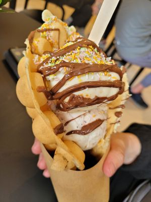 Bubble waffles with cherry and choc chip ice cream (bottom), biscoff ice cream, chocolate sauce, rainbow sprinkles (requested no squirty cream) at Lick in Bakewell