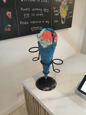 Candyfloss and cookie monster with bubblegum sauce and sherbert in a blue (bubblegum I think) cone at Lick in Bakewell
