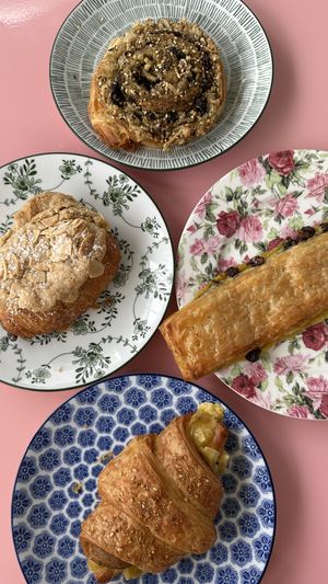 Top: olive jalapeño cheese, left: almond, right: pain suisse, bottom: ham & cheese  at Chaumont Bakery & Cafe in Santa Monica