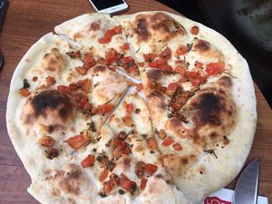 Starter : plain pizza dough with tomato  at L'Osteria - La Part-Dieu in Lyon