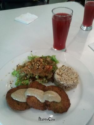 Daily lunch: falafel with eggplant sauce, brown rice, salad with almonds and a light vinaigrette, and cold hibiscus tea. at VG-Tal in Bogota