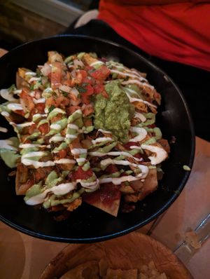 Vegetarian nachos with regular cheese and vegan chicken at Ranchos Cocina in San Diego