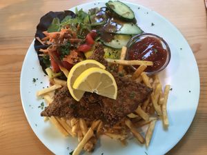 Schnitzel with fries and salad. Great taste at Hirschbachstueberl in Lenggries
