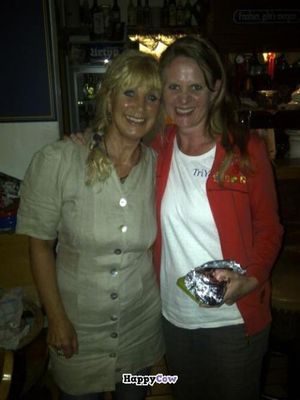 with the owner (and a piece of cake for take away) at Hirschbachstueberl in Lenggries