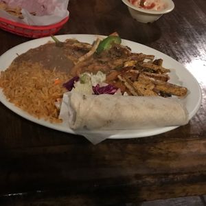 Vegan chicken ranchero with rice, beans and tortillas  at Pokez in San Diego