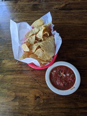 Complimentary tortilla chips with tomato salsa at Pokez in San Diego