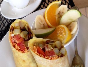 Smoked burrito w fakin bacon and vegan cheese. Also LOVED that they asked if I wanted fruit versus charging me extra for it.  at Bay Naturals in Myrtle Beach