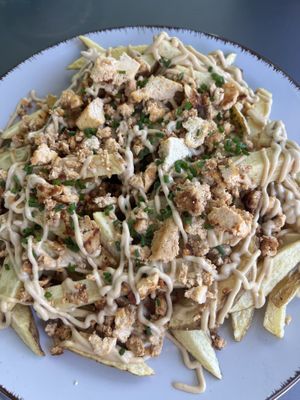 Patatas a la parmesana  at Rúkula Vegan Food in Malaga