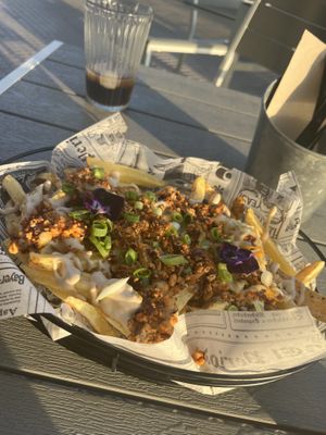 Tofu cheese fries   at Rúkula Vegan Food in Malaga