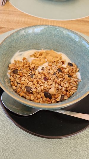 Yogurt with granola at Oásis da Lagoa in Vila Nova De Santo Andre