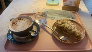 Hot chocolate with a shot of espresso (by special order) and an apple tartt  at Café "das Goldstück" in Vienna
