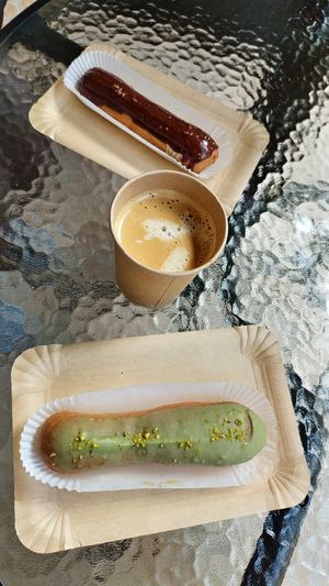 Caramel and pistachio eclairs at Eclair Lab in Warsaw