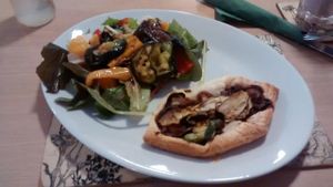Caramelized red onion-zucchini pie with roasted vegetables at Global Tribe Cafe in Leeds