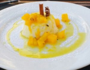 Coconut pudding with fruit reduction. at Essencia in Porto