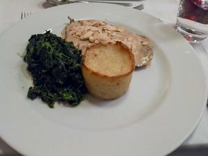Main dish: saitan steak with almond topping, spinach and potato at Essencia in Porto
