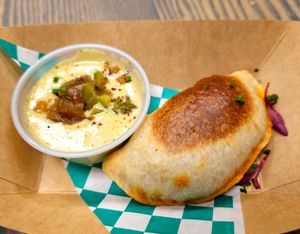 Housemade chorizo and sautéed potato empanada at Vegan Chula at 51 & Tel in Oakland