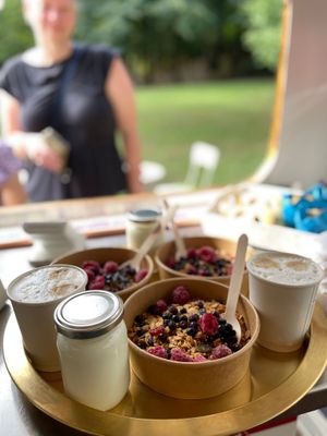Breakfast is served - homemade mixed berry granola, served with yogurt or milk (dairy & vegan options available) at Rex's Bar at ECO River Camp in Radovljica