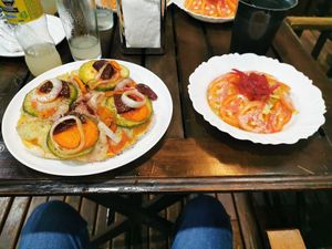 Pizza with cheese made of potatoes and a salad at Wicz Bar in Puerto Iguazu