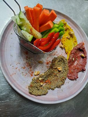 Veggie sticks 😋 served with hummus, beetroot dip, olives paste home made at Sweet Lounge Cafe & Restaurant in Armacao De Pera