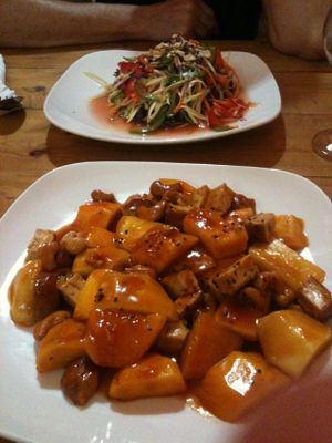 Cashew, mango, tofu in my plate ; salad in my friend's plate. 3-4$ dollars for each at Cafe Soleil in Phnom Penh