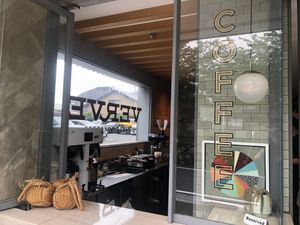 The coffee shop has huge glass windows  at Verve Coffee - Kamakura Yukinoshita in Kamakura