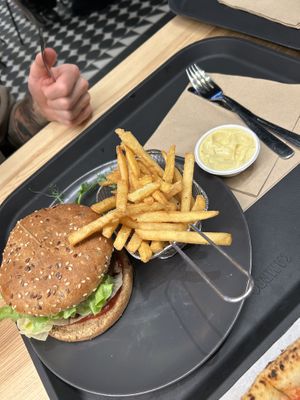 Burger and fries. Curry mayo with it   at Veg Stop in Riga