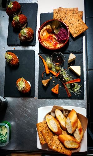Selection of starters - Mushrooms arancini, hummus Plate & V-Cheese Platter at Manipura in Tenerife