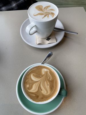 Flat white (yum!) with oat milk and a vanilla soy latte, also yum!  at Columbus Coffee in Greymouth