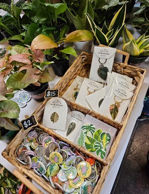 Keychains and pins at Hella Plants Market in Oakland